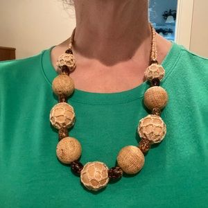 Tan wood beaded necklace.